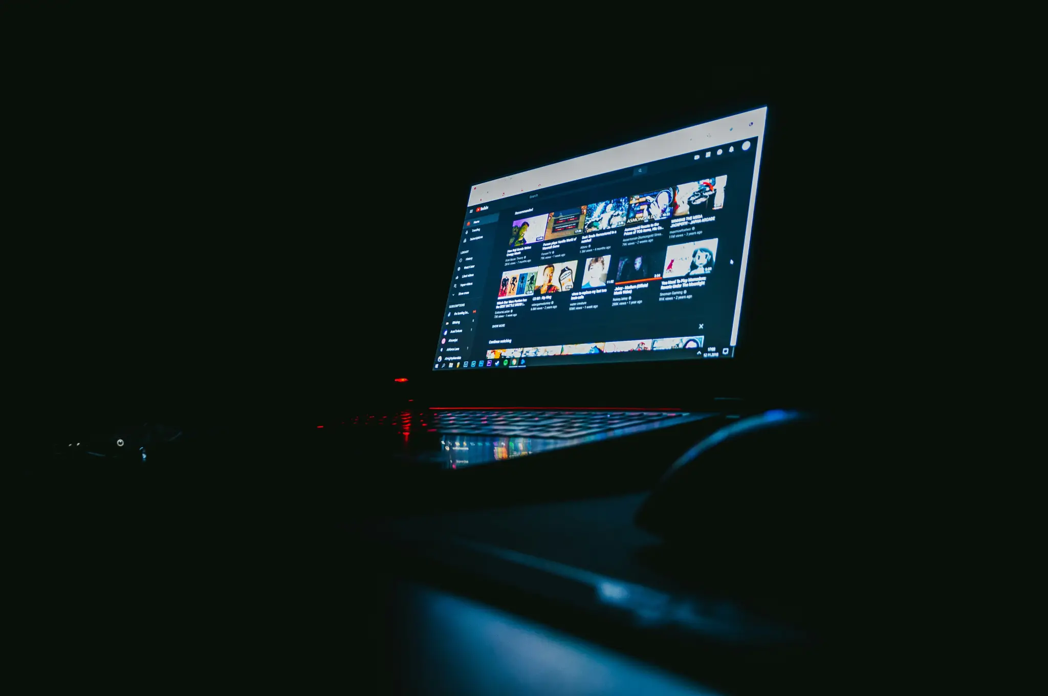 A person working on a laptop in a modern, focused environment, representing a professional user.